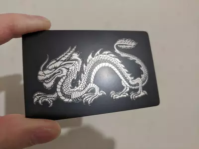 Стальная визитка с NFC чипом черного цвета с лазерной гравировкой White Dragon